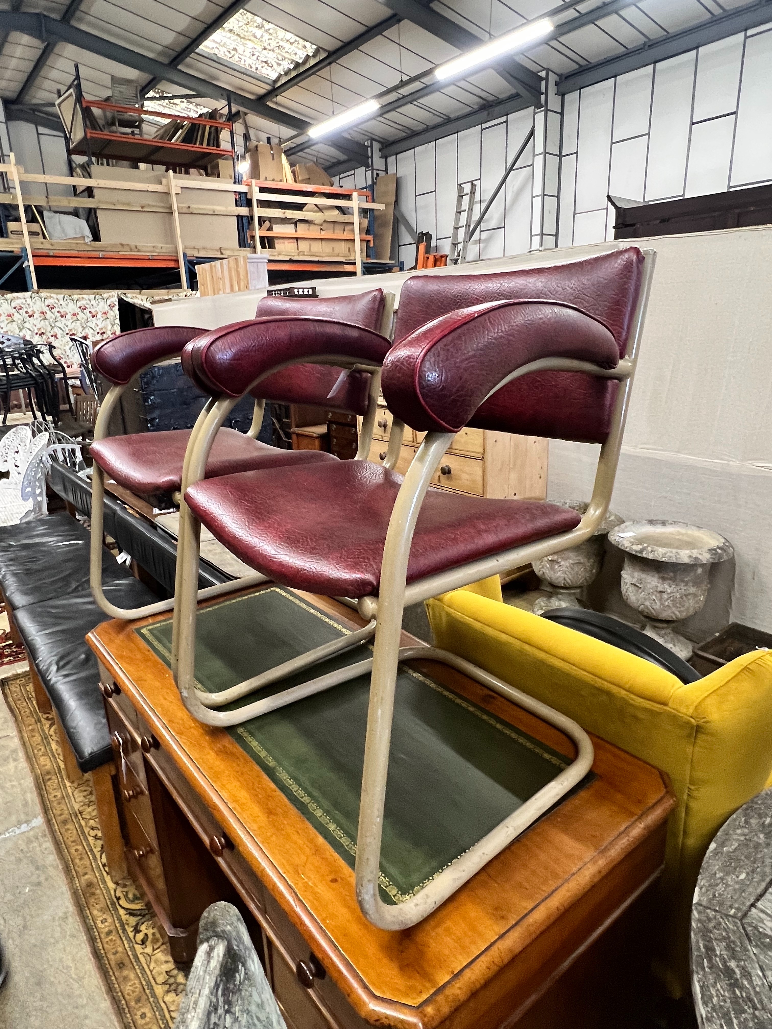 A pair of Pell elbow chairs, width 56cm depth 44cm height 78cm